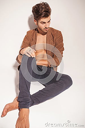 Full body image of a sexy young man resting