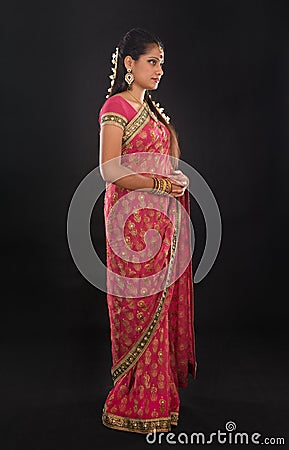 Full body traditional young Indian girl in sari