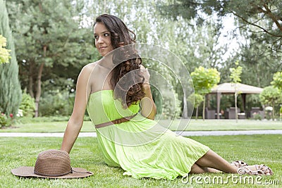 Full length of attractive young woman in sundress at park