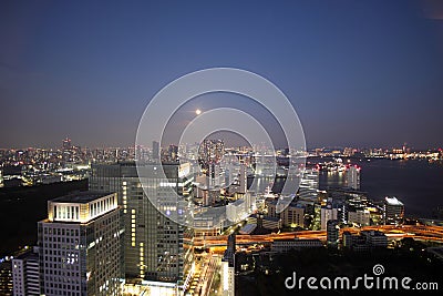 Full moon and light up buildings in Tokyo