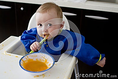 Funny baby eating diversification