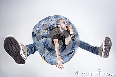 Funny crazy man dressed in jeans and sneakers