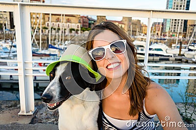 Funny dog and woman on summer vacation travel