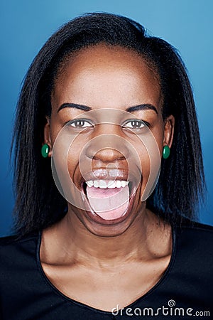 portrait of real funny face african woman on blue background - Stock Image - Everypixel portrait of real funny face african woman on blue background - Stock Image - Everypixel
