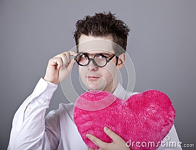Funny men with toy heart.
