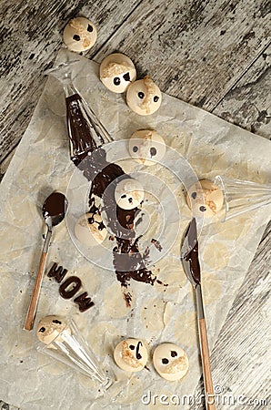 Funny meringue with chocolate on baking paper