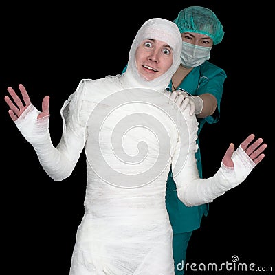 Funny sick in bandage and nurse on black