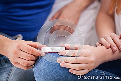 Future parents with positive pregnancy test