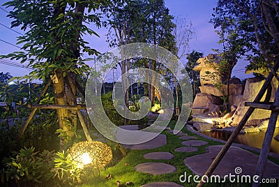Garden at night with waterfall