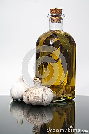 Garlics and olive oil bottle