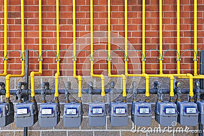 Gas meters on brick wall