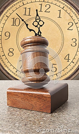 Gavel and old clock