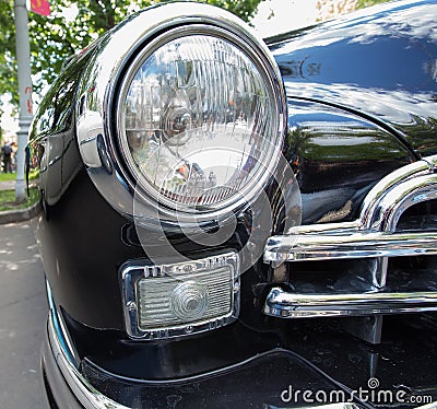 GAZ-12 ZIM car headlight on show of collection Retrofest cars