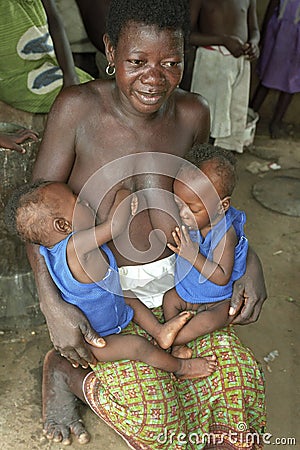 Ghanaian Mother breastfeeding twins