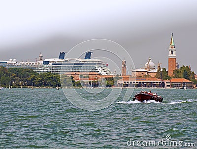 Giant cuise ship passing by the islands of Venice lagoon