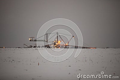 Giant excavator in a coal open pit evening