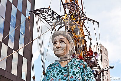 Giant Grandma puppet walks the streets of Liverpool.