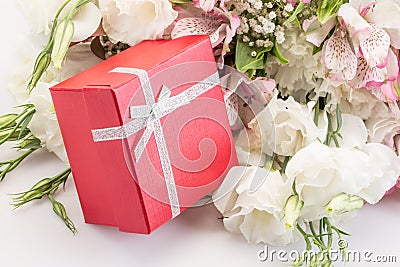 Gift on bouquet of flowers