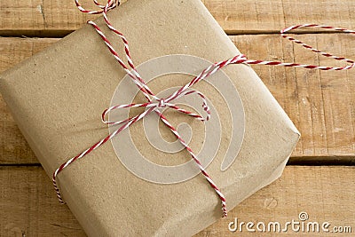 Gift box wrapped in recycled paper with ribbon bow