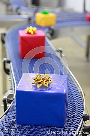 Gifts on conveyor belt in Christmas presents facto