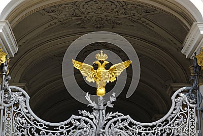 Gilded coat of arms of the Russian Empire at the gate of the Her