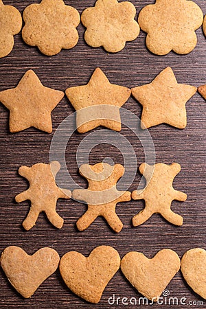 Gingerbread cookies bears in dance with hearts and stars