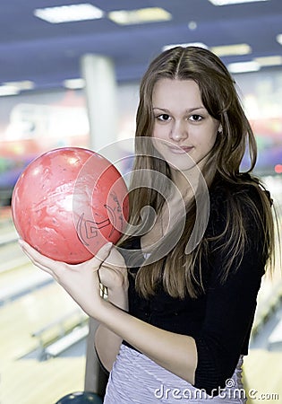 Girl with 10 pin bowling ball