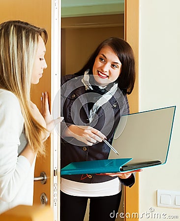 Girl answer questions of smiling girl at home