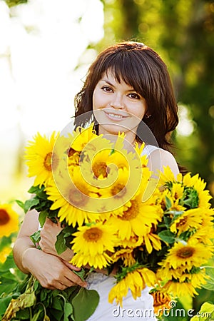 Girl with a bouquet of sunflowers