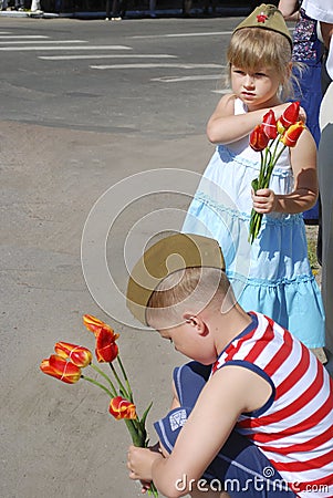 Girl and boy congratulates veterans on Victory Day and wants to