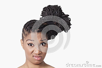 Girl with braids smirking