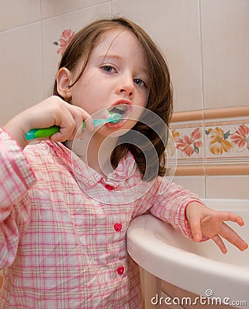 Girl brushes teeth