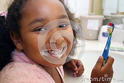 Girl brushing teeth