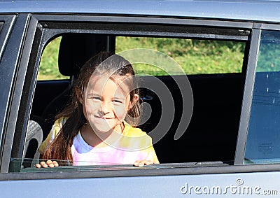 Girl in car window