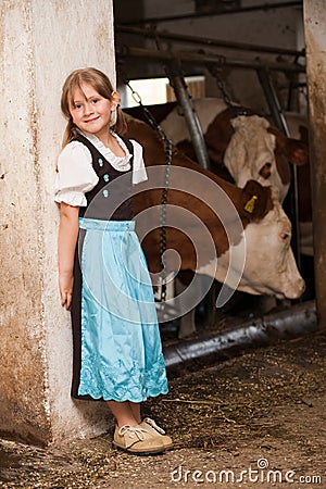 Girl in a cow stable