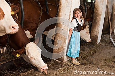 Girl in a cow stable