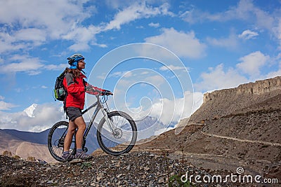 Girl cycling at the road