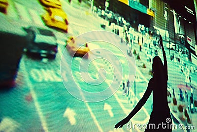 Girl dancing in front of video projection