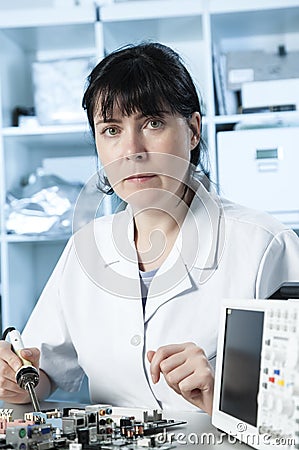 Girl debugging an electronic precision device