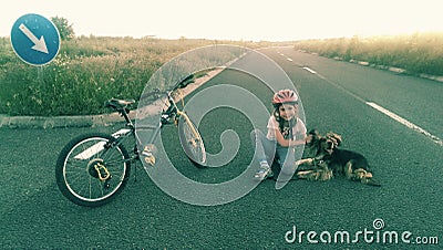 Girl and dog in the road