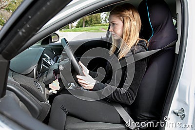 Girl driving a motor car