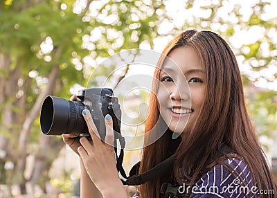 Girl with DSLR camera