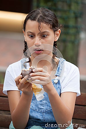 Girl Eating a Boston Cream Pie