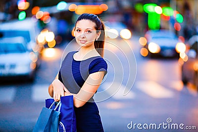 Girl on evening city background