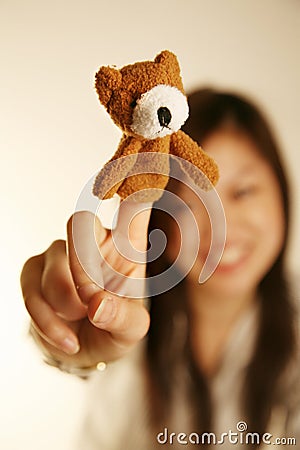 Girl with finger puppet bear