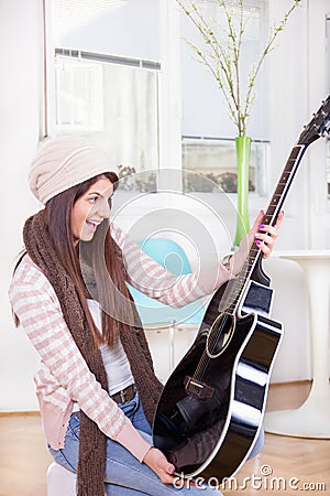 Girl gets a guitar as a present