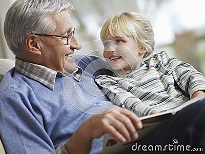 Girl With Grandfather Reading Story Book