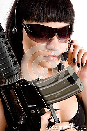 Girl with gun and headphones
