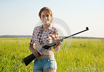 Girl holding pneumatic air rifle