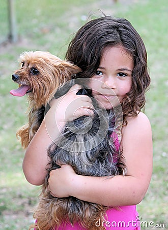 Girl hugging her dog
